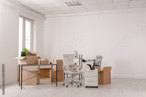 Fotografi Carton boxes with stuff in room. Office move concept