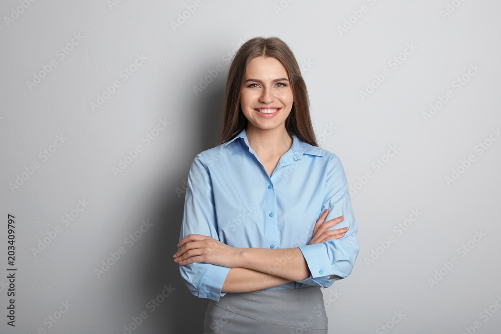 Beautiful real estate agent on grey background Beautiful real estate agent on grey background