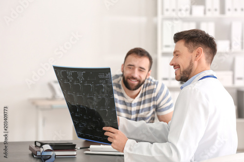 Doctor consulting male pati...