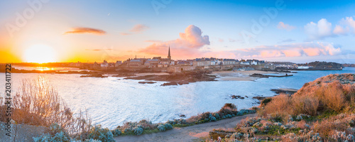 Panoramic view of walled city Saint-Malo with St Vincent Cathedral at sunrise. Saint-Maol is famous port city of Privateers is known as city corsaire, Brittany, France