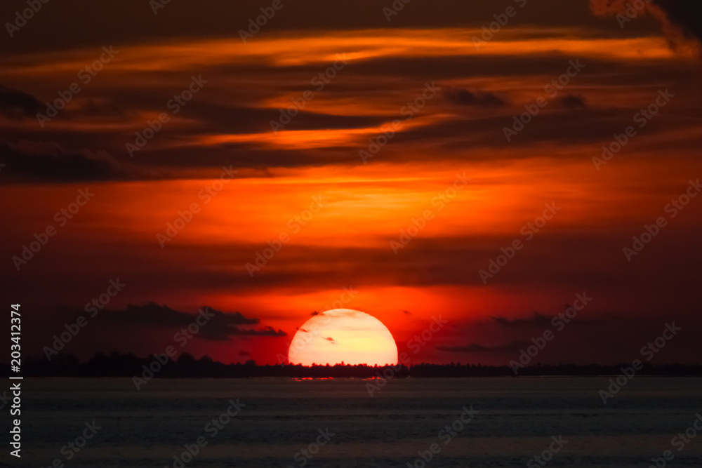Ornate sunset at the sea horizon