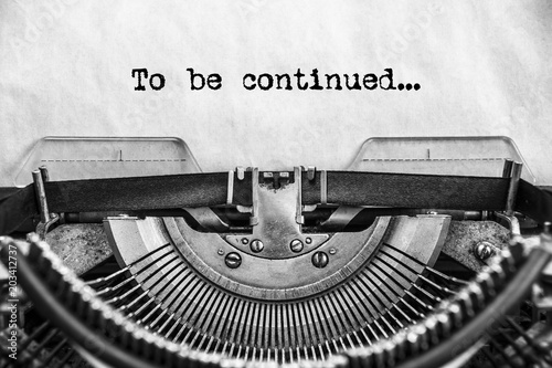 To be continued... typed text on a vintage typewriter. old paper. Close up. history