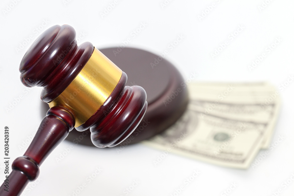 Judge Gavel with banknote on white background