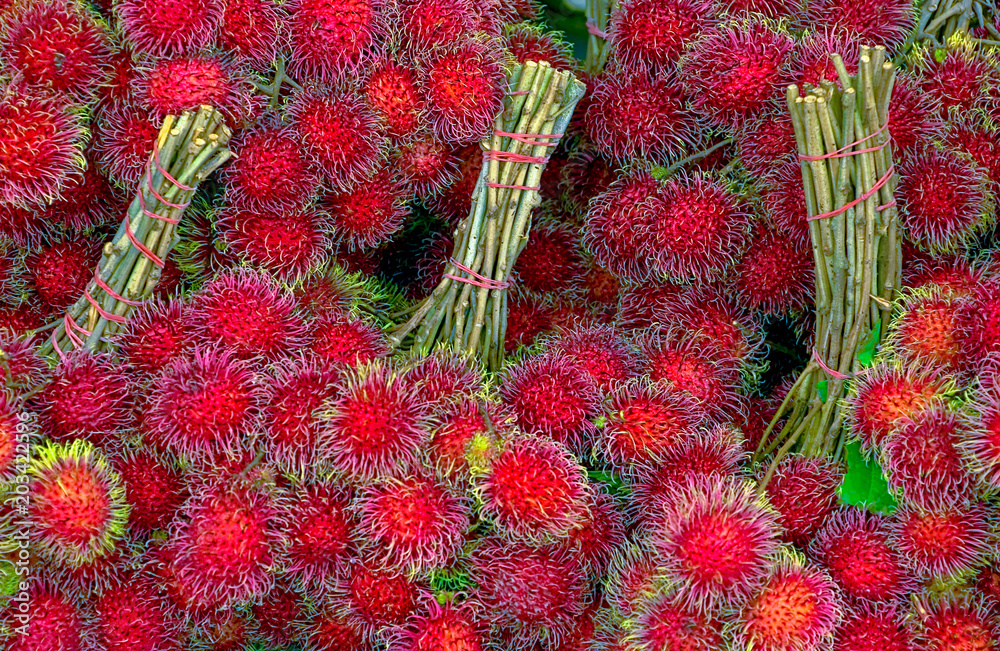 Fototapeta premium Rambutan fruit at a Thai market 