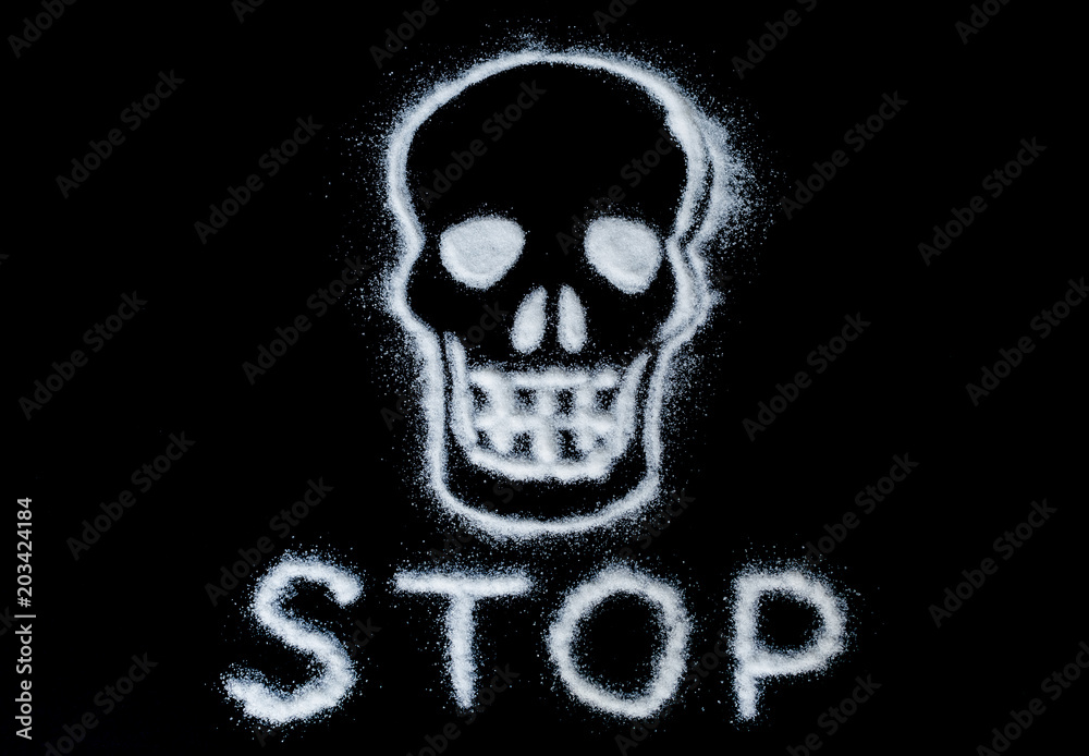 skull painted with white sugar and text stop on a black background. caution sign skull painted with white sugar and text stop on a black background. caution sign