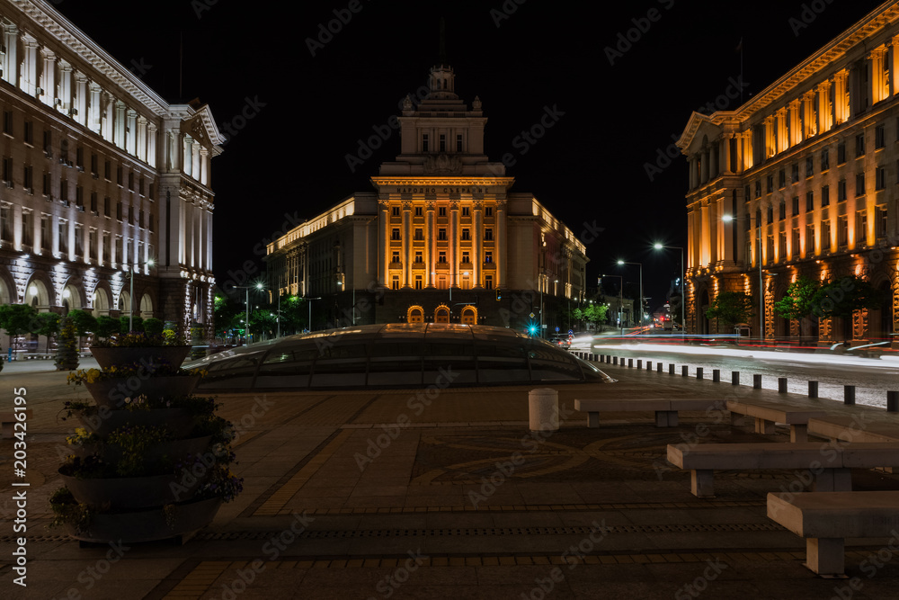 Fototapeta premium The City centre of Sofia at night, Bulgaria. Buildings of Presidency, Council of Ministers and Former Communist Party House. Text National Assembly in Bulgarian on the building.