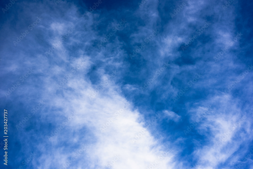 Bright blue sky with white cloud