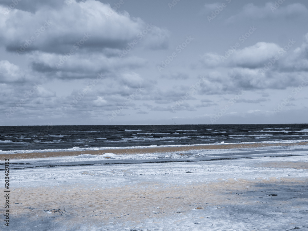 Endless expanses on a snow-covered beach in Jurmala, on the shore of the Gulf of Riga, in winter 2018.Latvia.