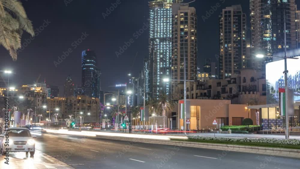 Street view of Dubai skyline timelapse and rush hour traffic in downtown at night Street view of Dubai skyline timelapse and rush hour traffic in downtown at night