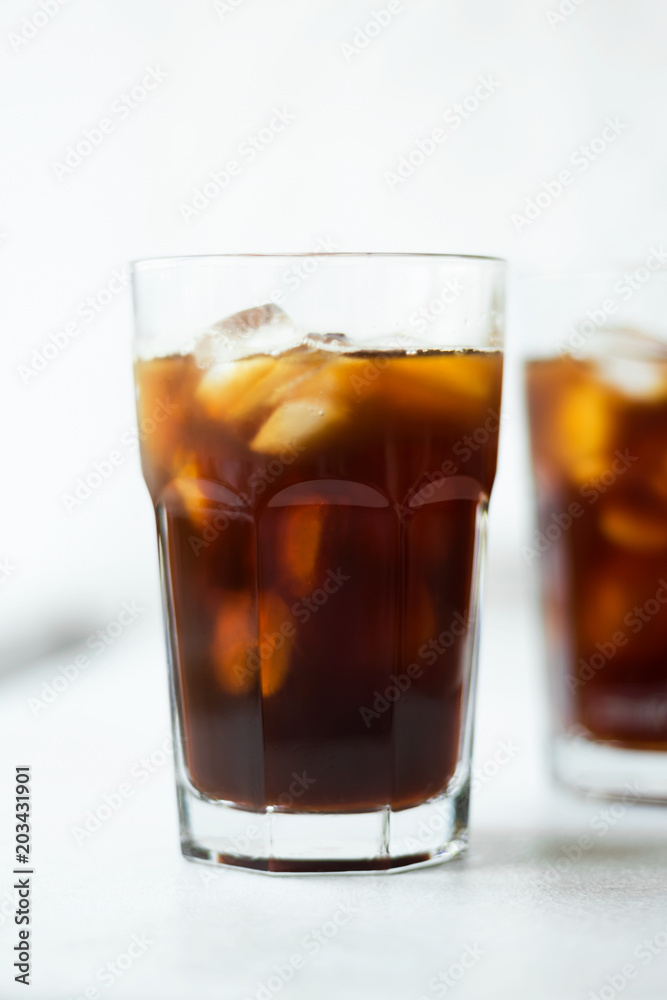Cold brew. Coffee with ice on light background Cold brew. Coffee with ice on light background