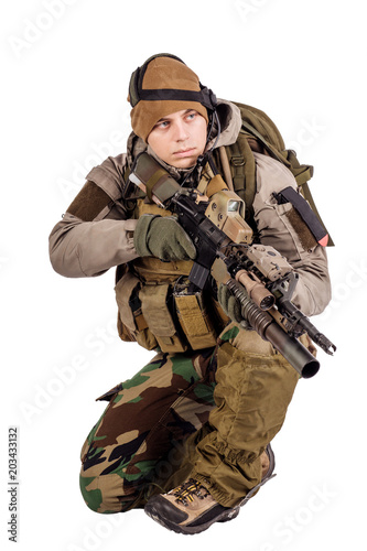 Soldier with rifle isolated on a white background. war, army, weapon and people concept.