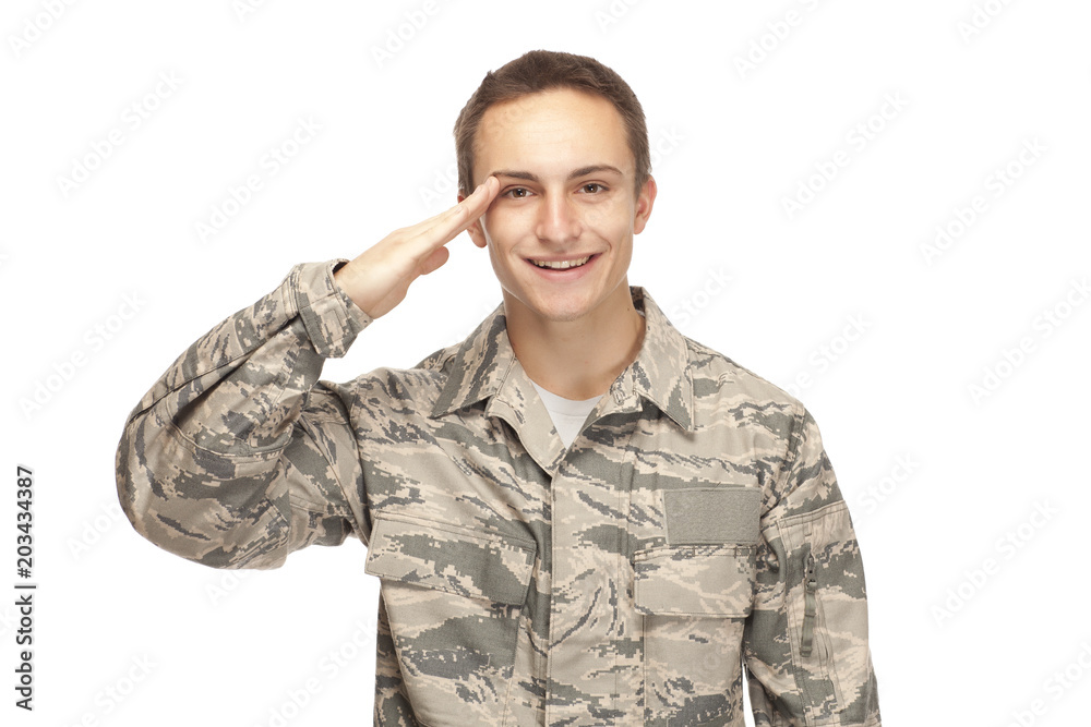 Smiling air force airman saluting Smiling air force airman saluting