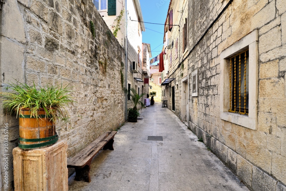 Picturesque medieval street in the old town of Trogir, Croatia