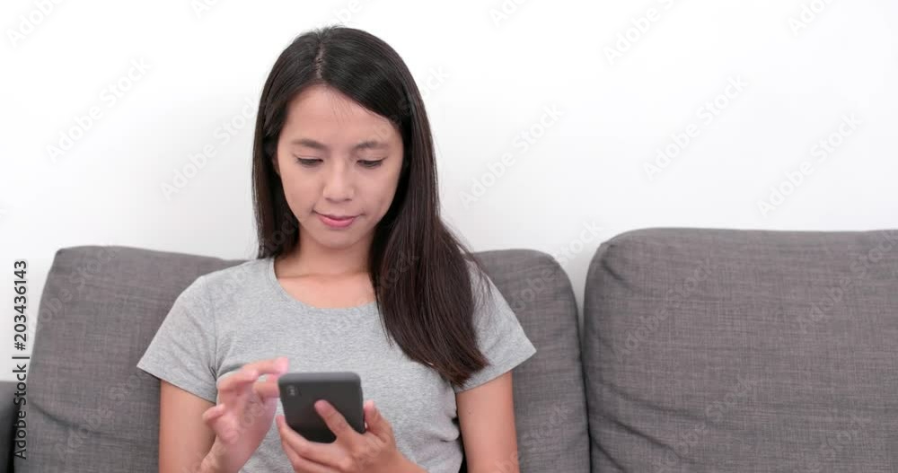 Woman use of mobile phone at home Woman use of mobile phone at home