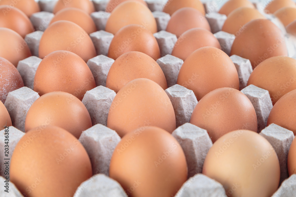 Chicken eggs are fresh in a cardboard package made of recycled waste paper.