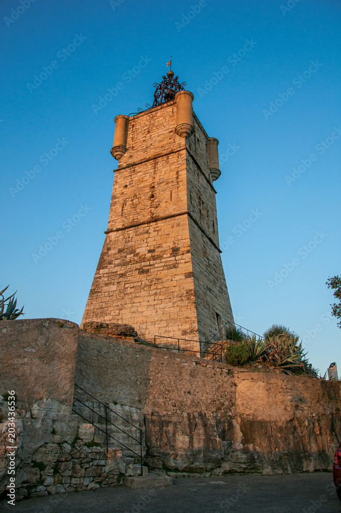 View of the clock tower made of stone and with a bell, stands on top of the hill dominating the whole gracious city of Draguignan. Located in the Provence region, Var department, southeastern France