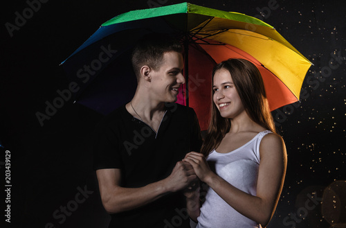 Couple young Teens with colored umbrella