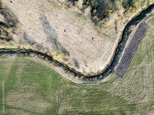 drone image. aerial view of rural area with wawy river ion forests photo