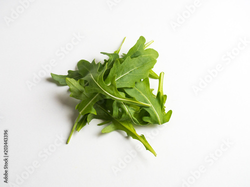 Arugula on white background
