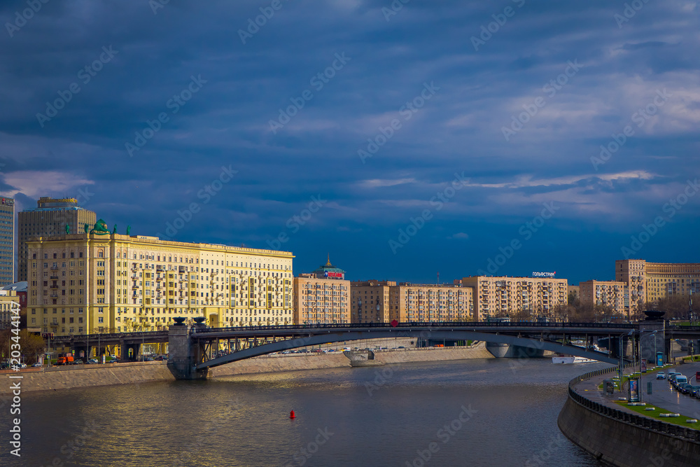 Outdoor panoramic view of Moscow and bridge over the Moskva River in conecting modern skyscrapers of Moscow-City. Landscape and cityscape of Moscow in cloudy sky