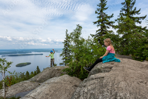 Young tourists on hill top in Koli National Park, Finland photo