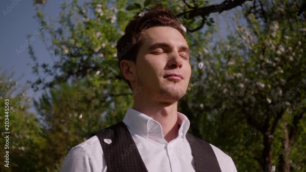 Portrait of a man in a spring forest. Slow motion Portrait of a man in a spring forest. Slow motion