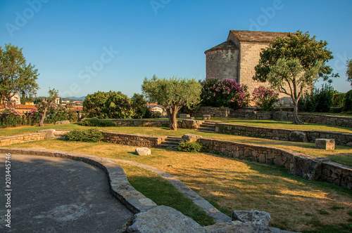 View of the tower clock garden on top of the hill in the light of sunset, over the lively and gracious town of Draguignan. Located in the Var department, Provence region, southeastern France photo