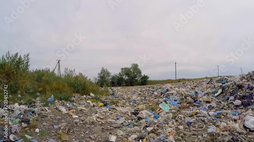 dump bordered by green grass.