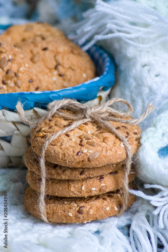 Fototapeta premium Cookies with sesame and sunflower seeds on plaid. Healthy eating