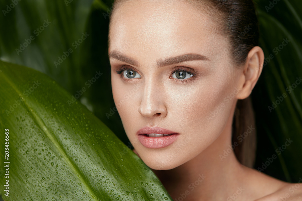 Beauty Woman Face With Healthy Skin And Green Plant Beauty Woman Face With Healthy Skin And Green Plant