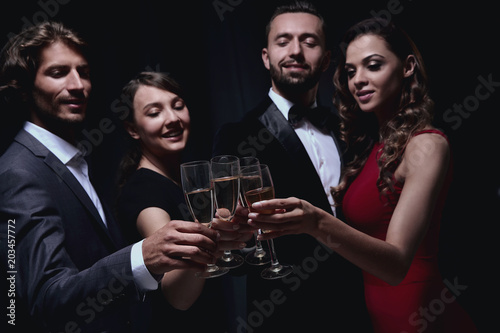 Cheerful people celebrating a sucess with Champagne