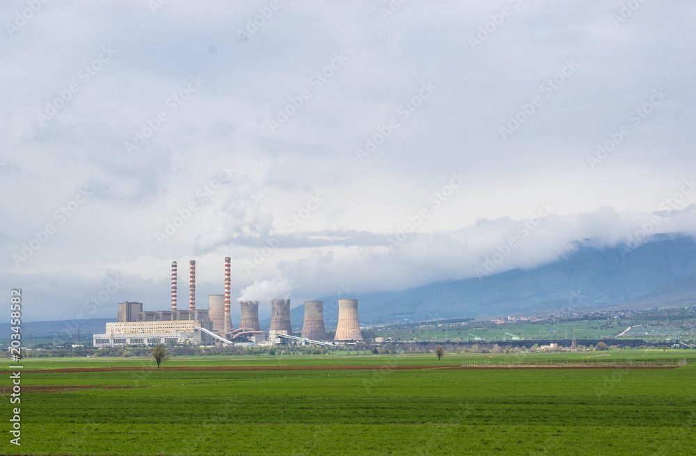 Power plant station in green field in Greece Power plant station in green field in Greece