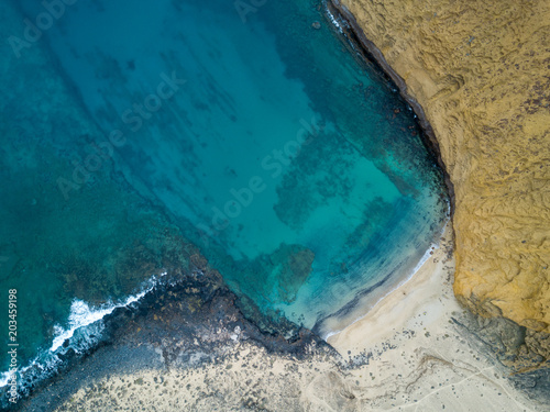 aerial view of deserted beach and reef