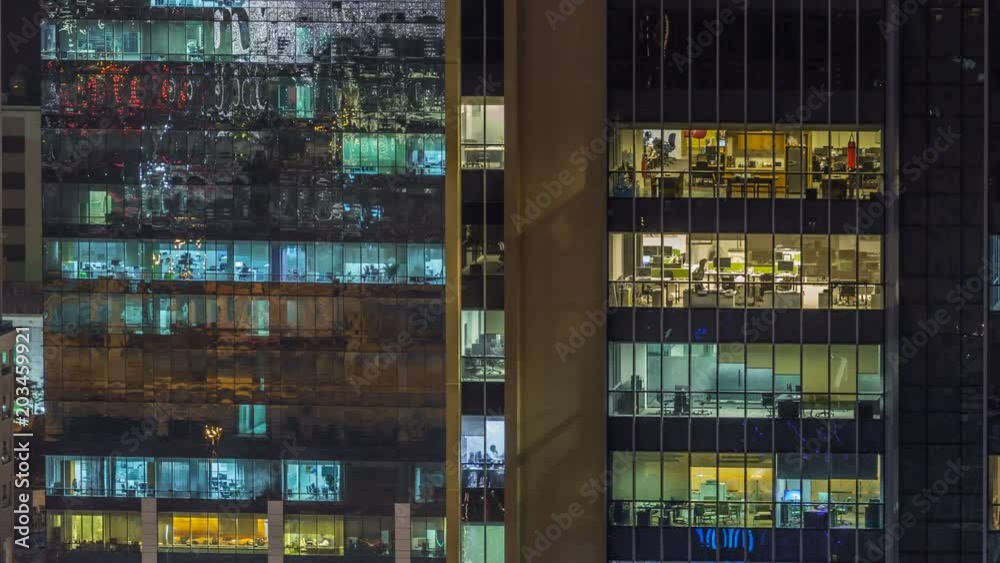 Scenic glowing windows of skyscrapers at evening timelapse Scenic glowing windows of skyscrapers at evening timelapse