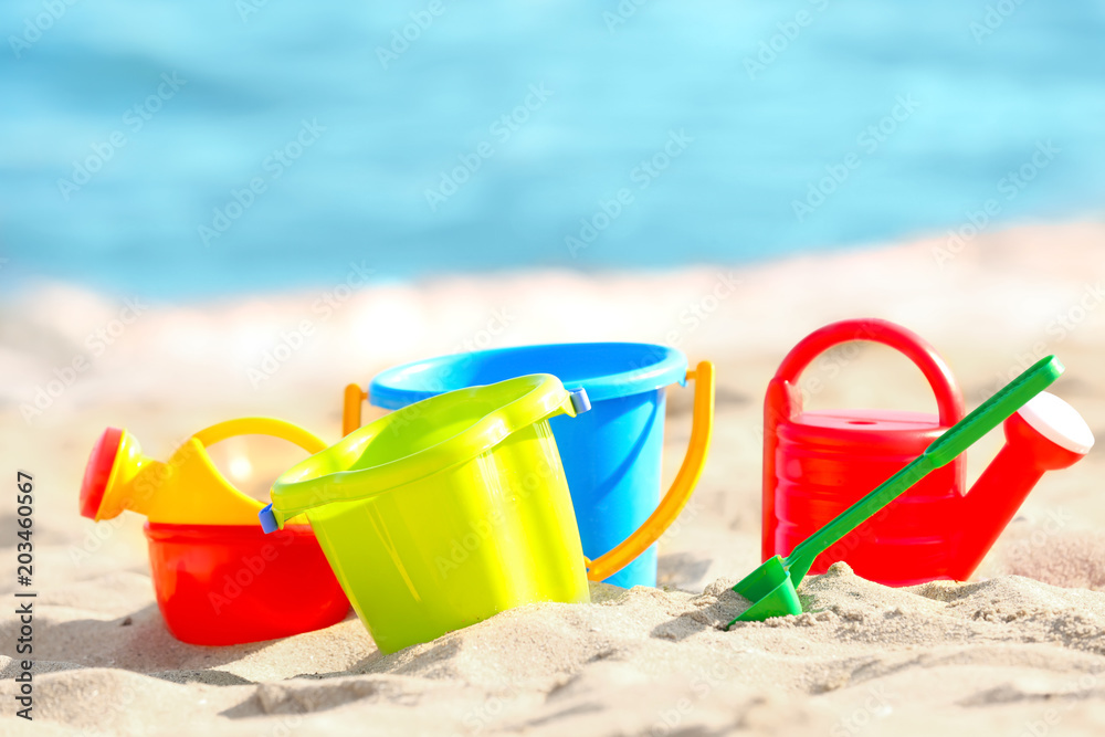 Colorful plastic sand toys on beach Colorful plastic sand toys on beach