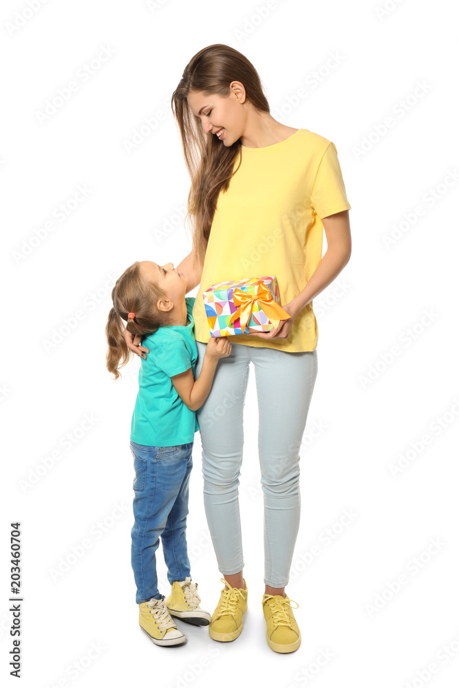 Cute little girl and her mother with gift box on white background Cute little girl and her mother with gift box on white background