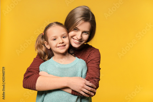 Portrait of mother and cute...