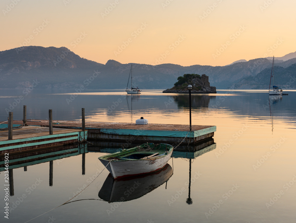 Fototapeta premium Boat reflected in the water, Selimiye village, Marmaris, Mugla city, Turkey country