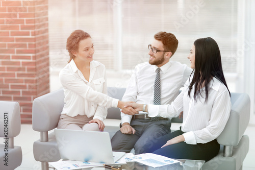 handshake of manager and client in the office lobby