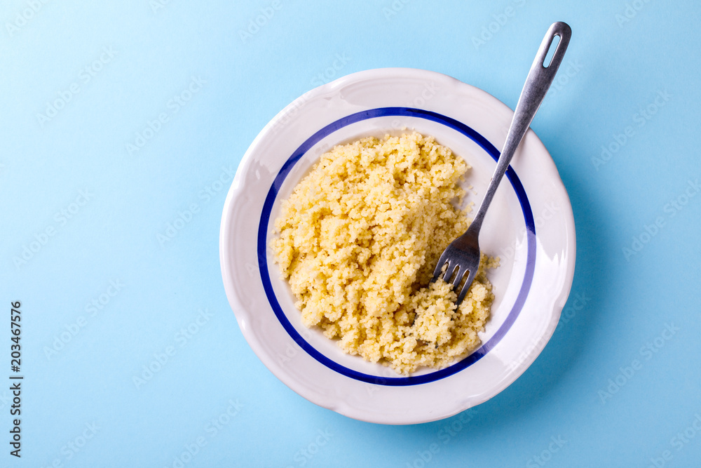 Salad Couscous with Olive Oil on a blue background Top View Copy space for Text  Flat Lay