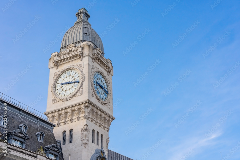 Clock tower of of Station Gare de Lyon- is one of the oldest and most beautiful train stations in Paris, mainline railway station terminal, building in Paris, France