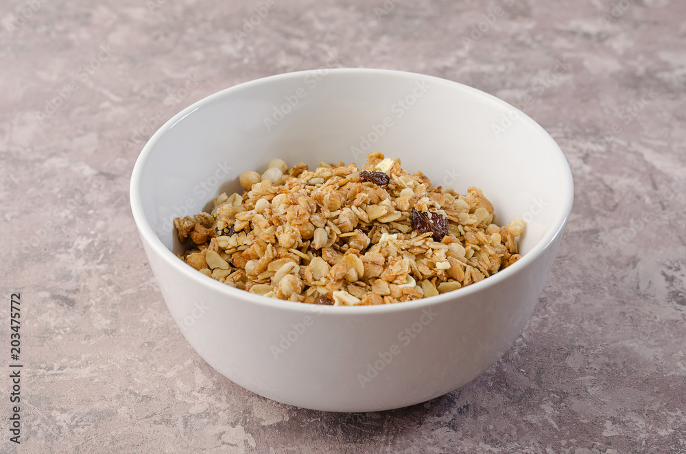 Granola in a white bowl Granola in a white bowl
