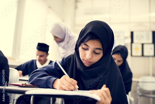 Photography diverse muslim children studying in classroom