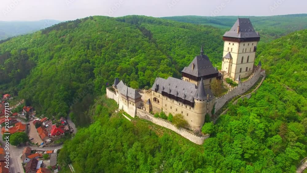 Camera flight around The Karlstejn castle. Royal palace founded King Charles IV. Amazing gothic monument in Czech Republic, Europe. Camera flight around The Karlstejn castle. Royal palace founded King Charles IV. Amazing gothic monument in Czech Republic, Europe.