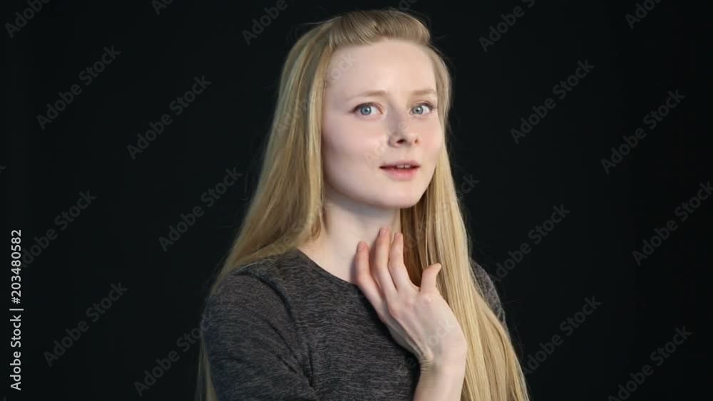 emotional portrait of a blond girl on a black background emotional portrait of a blond girl on a black background
