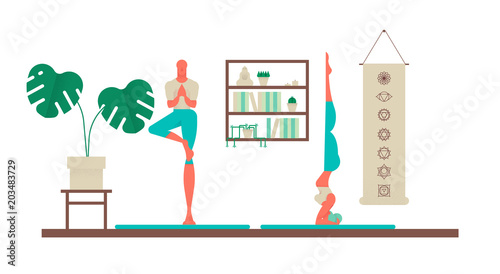 Woman and man doing yoga poses at home
