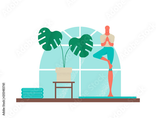 Boy doing yoga tree pose for healthy lifestyle