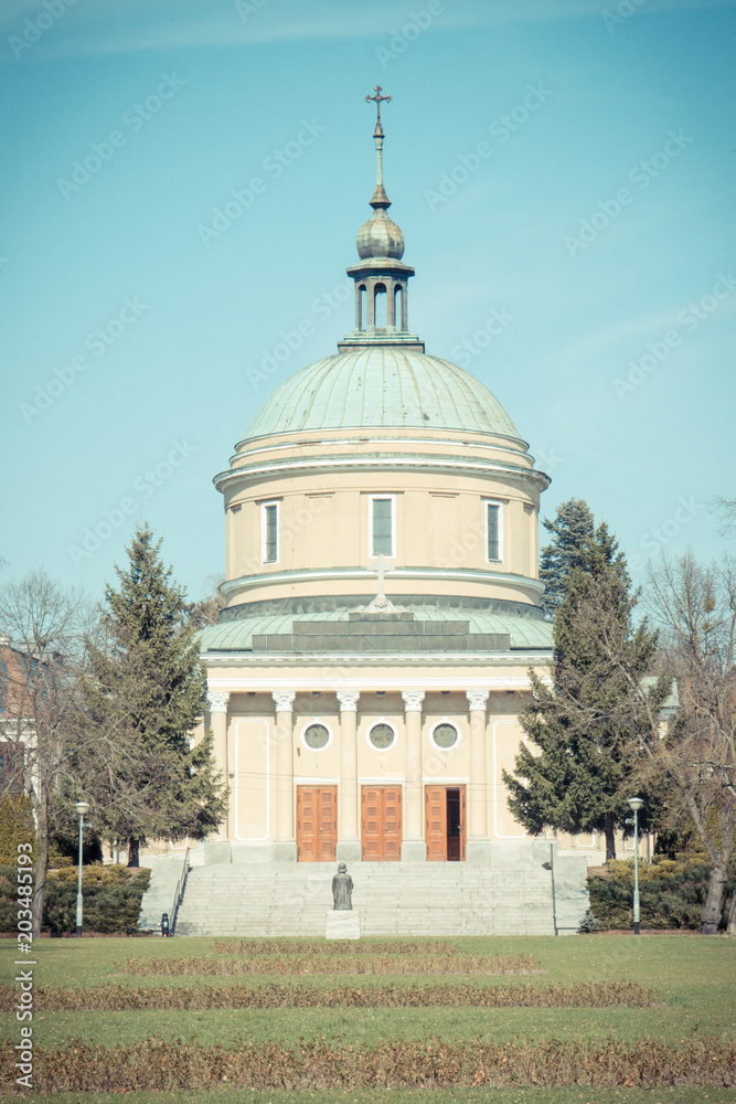 Poznan, Poland - April 1, 2017: Vintage photo, View on church of St. John Vianney on blue sky background