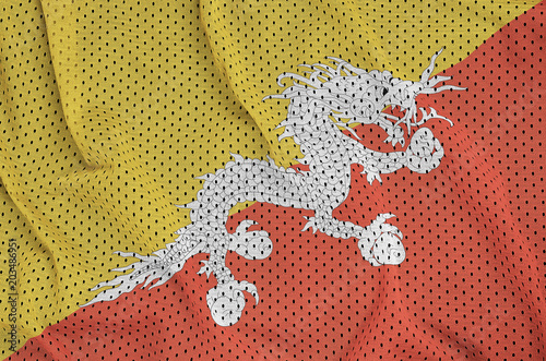 Bhutan flag printed on a polyester nylon sportswear mesh fabric with some folds photo