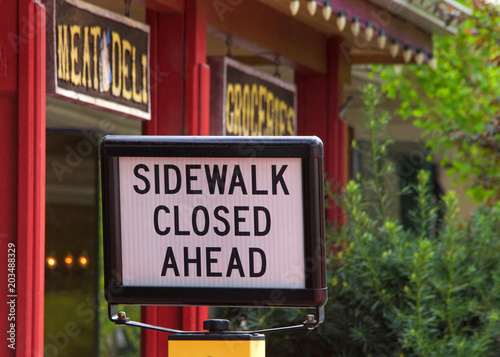 Sidewalk closed sign in front of a deli in Northern California. Rural town.